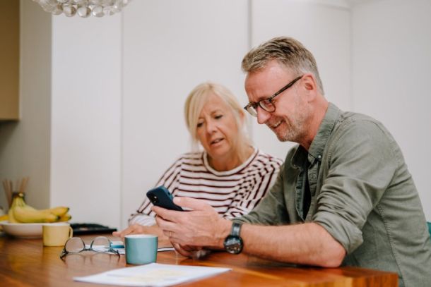 A couple going through paperwork together.