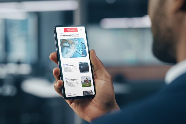 A man checking the news on his smartphone.