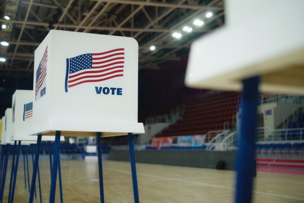 A voting booth with an American flag.